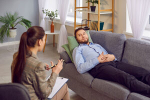 a man talks to a therapist about alcohol rehab outside of georgia