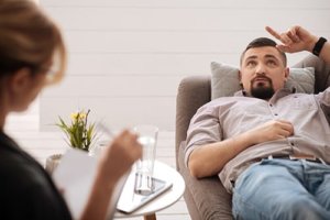 man talking to his doctor in his adjustment disorder treatment program