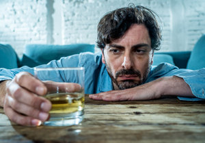 man struggling with alcoholism and PTSD