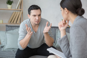 man discussing his need for social skills development with his therapist