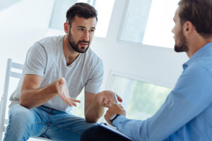 two men talking at a mens heroin rehab center