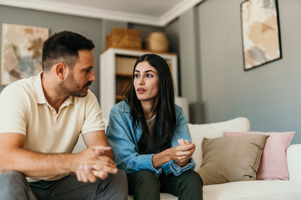 a man and wife sit and talk about the types of addiction