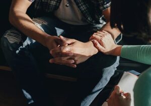 a therapist comforts a client during co-occurring disorder treatment