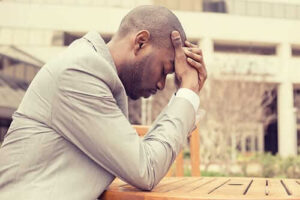 young man suffering from one of the most common types of depression