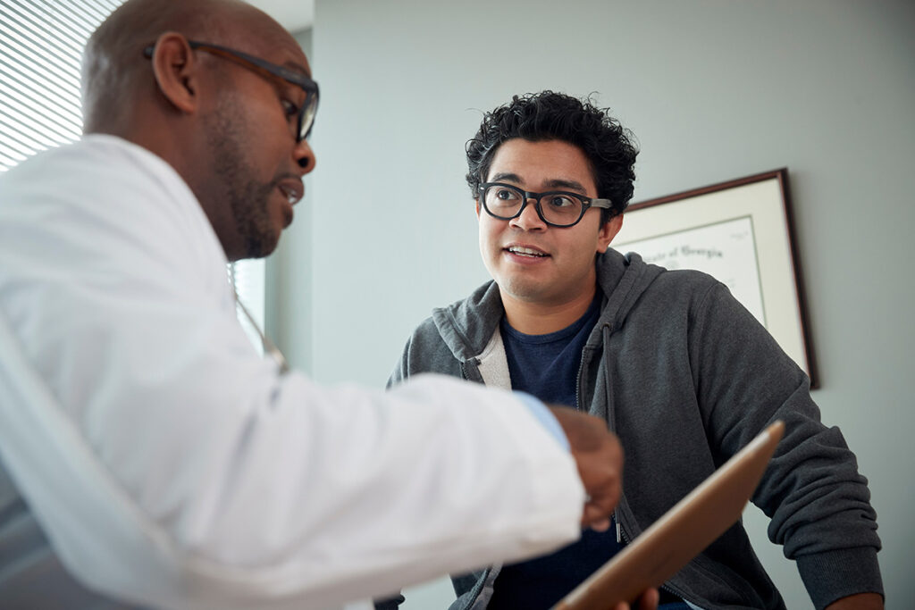 a young man talks to a doctor about depression medication for men