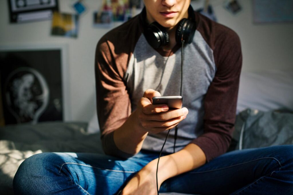 Young man reading article named what is a screen addiction