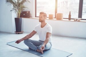 a person does yoga, a form of holistic therapy