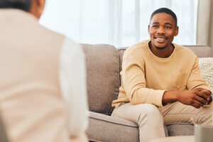 a man talks to a therapist during cocaine addiction treatment